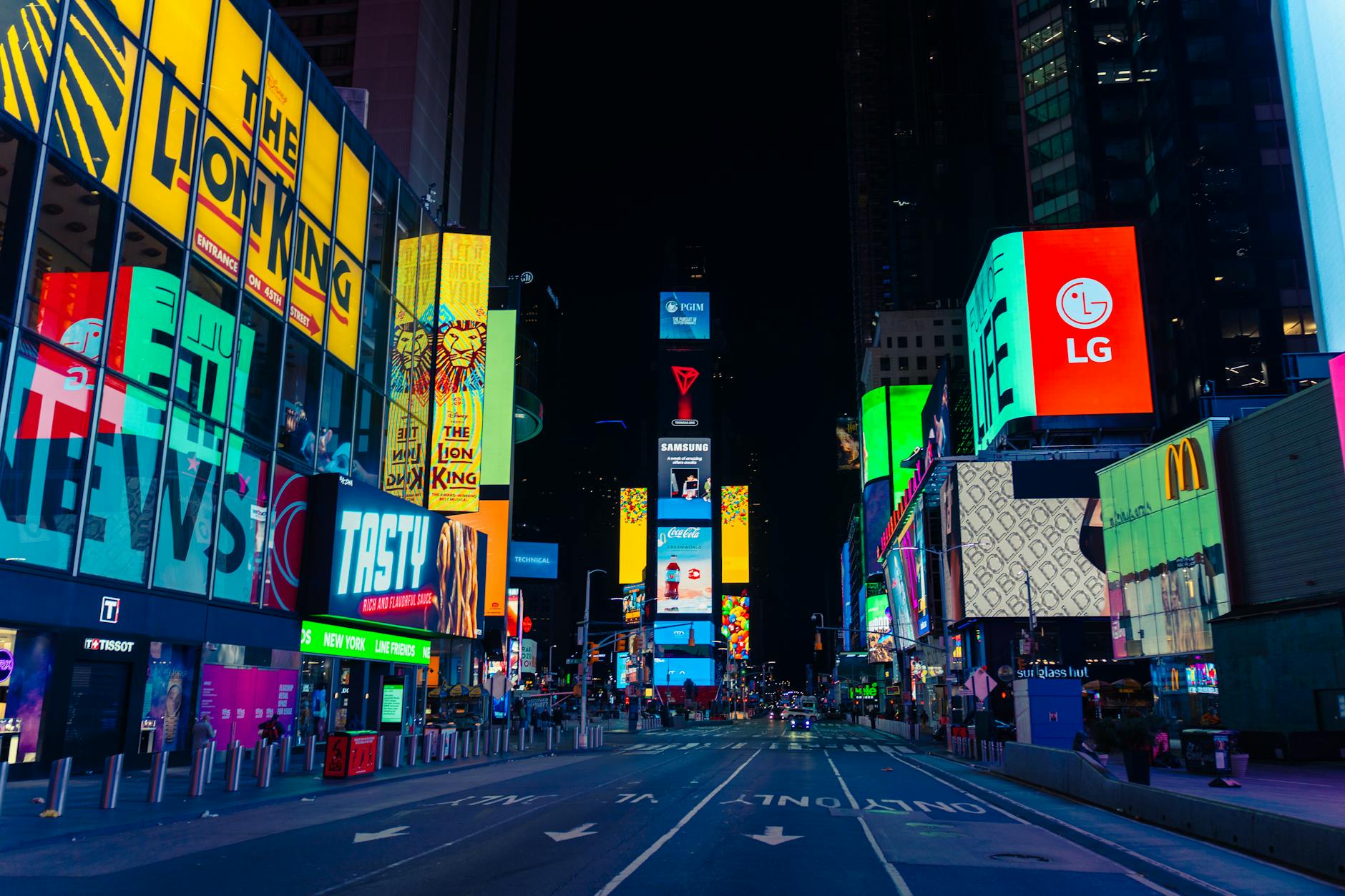 times square at night, with The Lion King