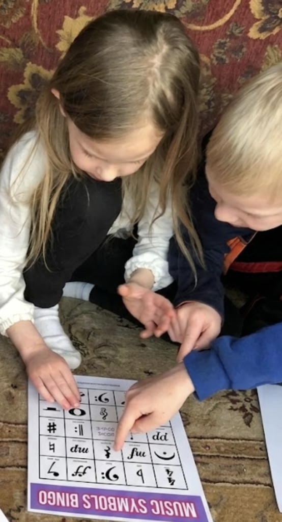 Kids playing music symbol bingo